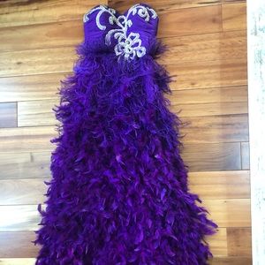 Purple prom gown with feathers.
